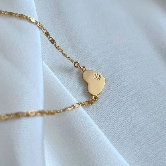 Tory Burch Elegant Gold Necklace with Heart and Disc Charms - Picture 3 of 7